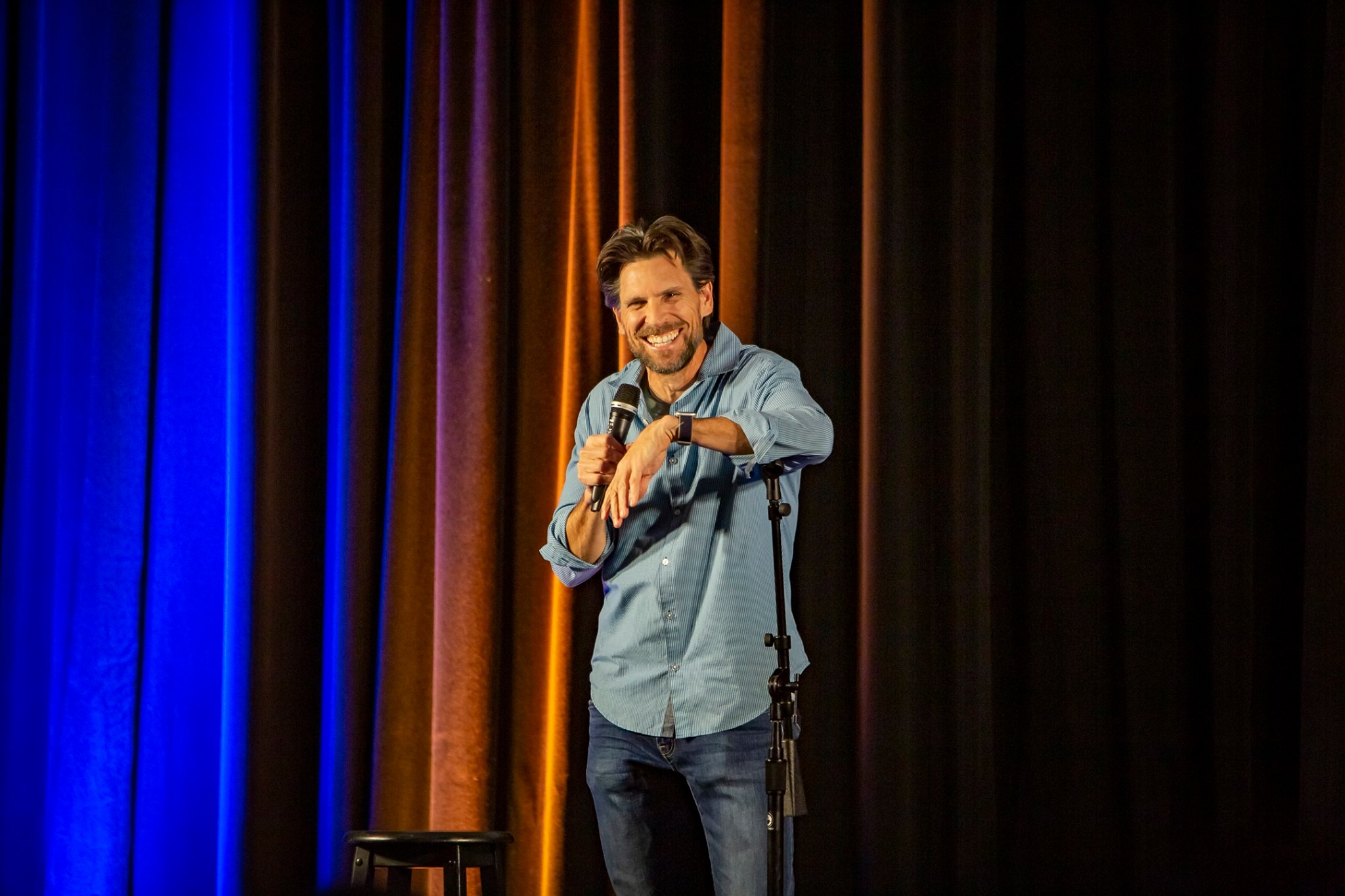 Comedian Don Friesen performing stand up comedy.