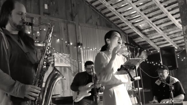 CozyCats band performing live in a barn