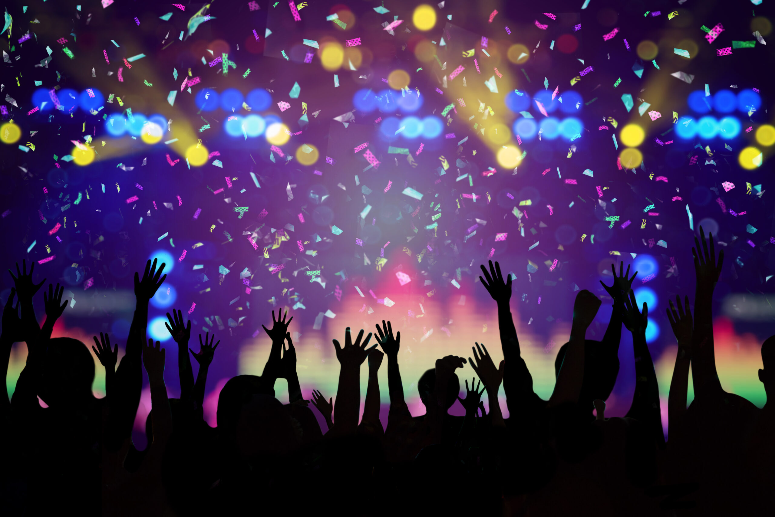 Abstract Party Background - Crowd People Enjoy Dancing and Show Hands Up in the Concert with Beautiful Lighting and Laser