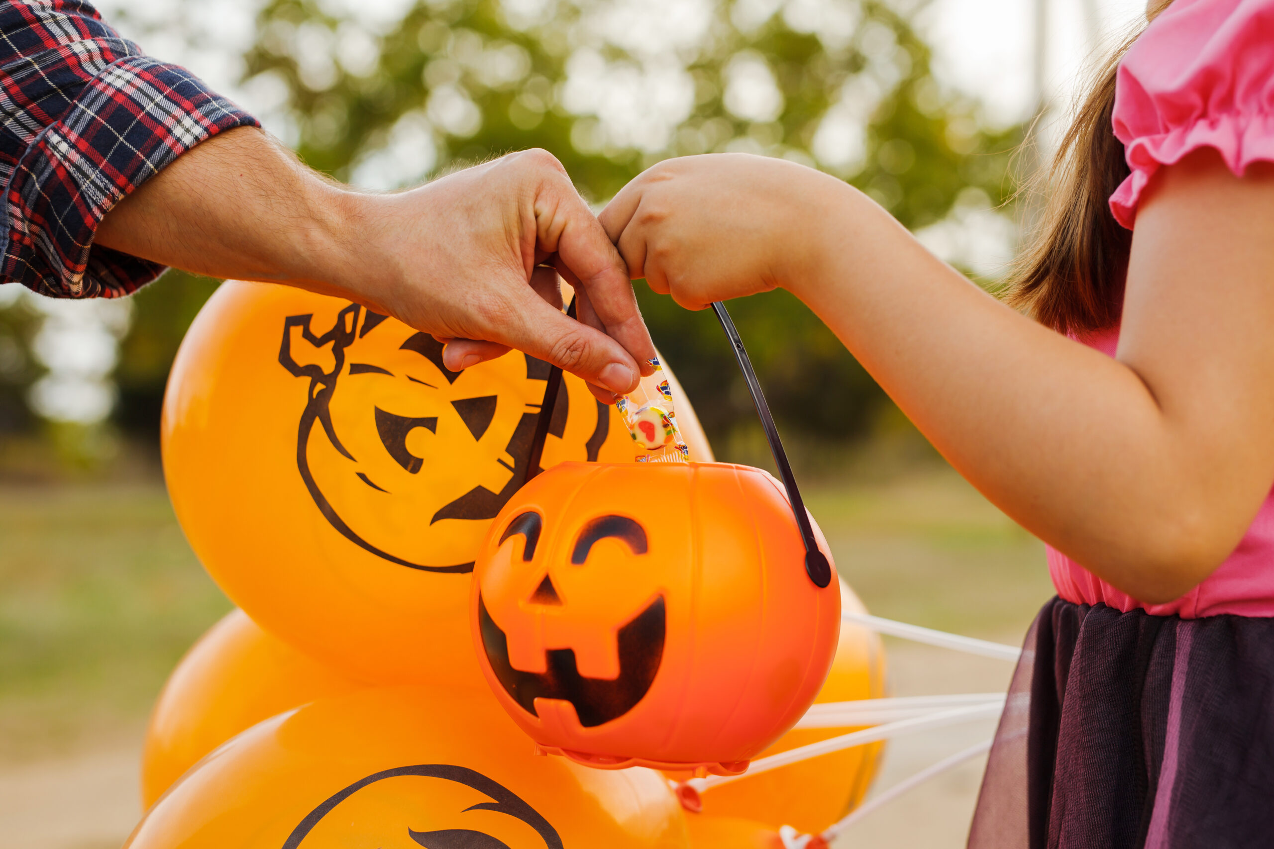 Little kid girl trick or treating on Halloween.