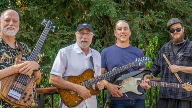 Noted live band posing with guitars