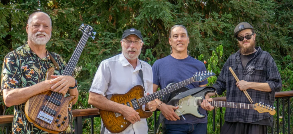 Noted live band posing with guitars